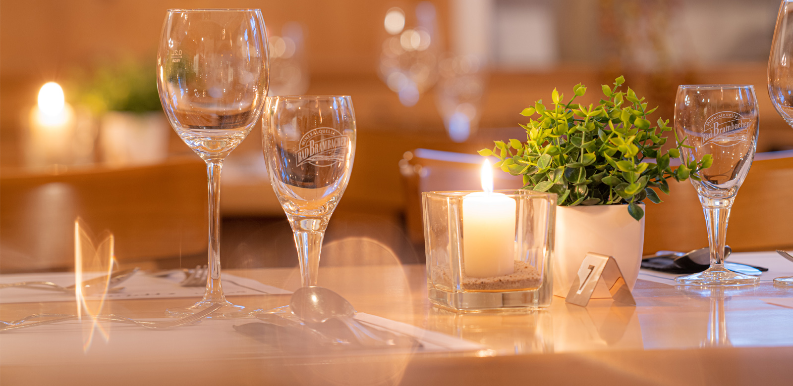 Table setting at Restaurant zur Sonne, with candlelight and glassware